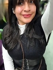 A mature woman is having fun with a young boy in the bedroom