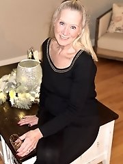 Hot MILF Tia posing in pink underwear for a photo session