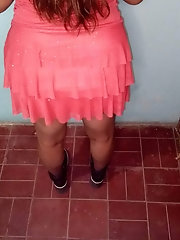 Good-looking female is getting undressed