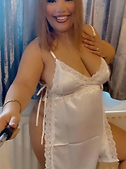 Seductive mature cutie is showing off her boobs